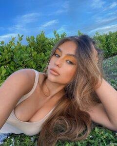 Madelyn Restivo outdoors with long brown hair